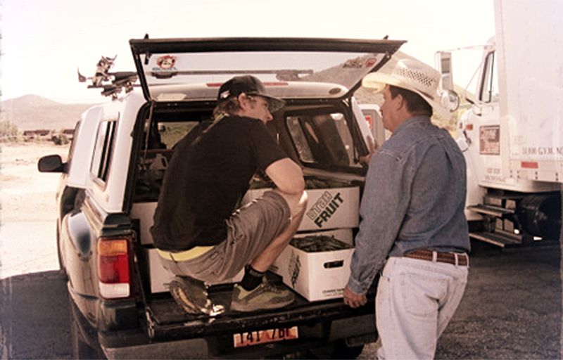 Image of two men working out of a truck